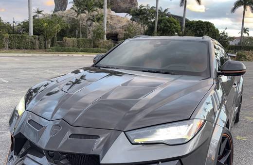 Grey Lamborghini Urus Mansory with carbon hood, front view