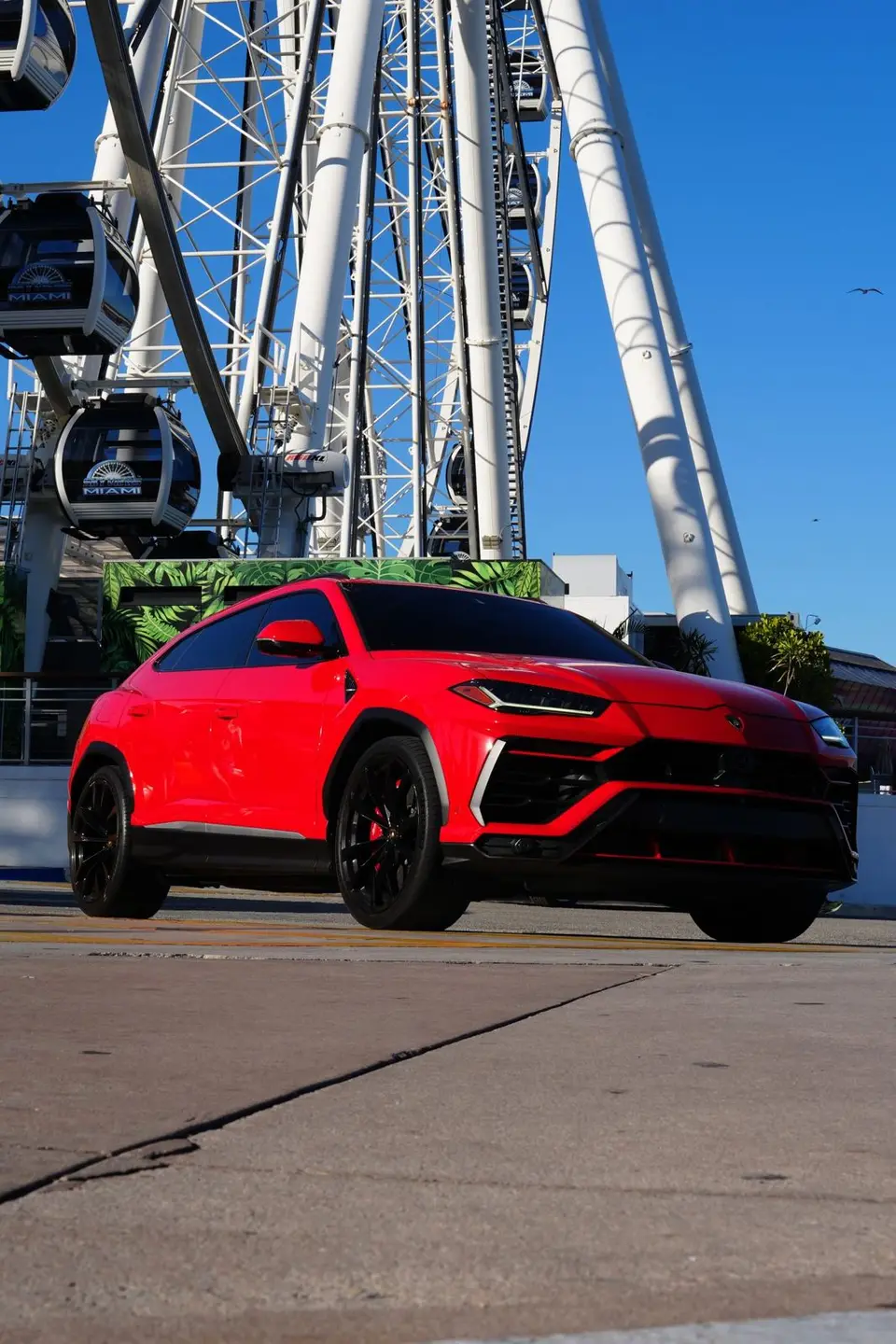 Red Lamborghini Urus, front three-quarter view
