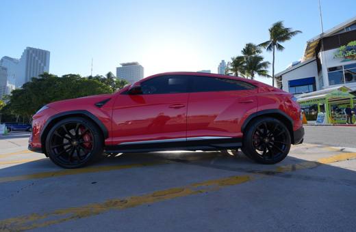 Red Lamborghini Urus, side profile