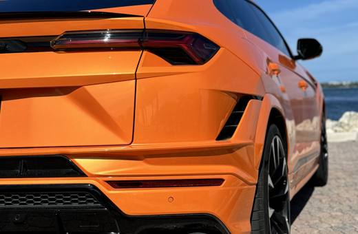 Pearl orange Lamborghini Urus S, rear quarter close-up