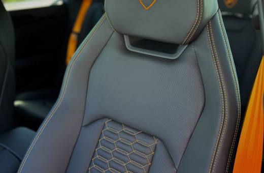 Lamborghini Urus S grey seat with orange stitching